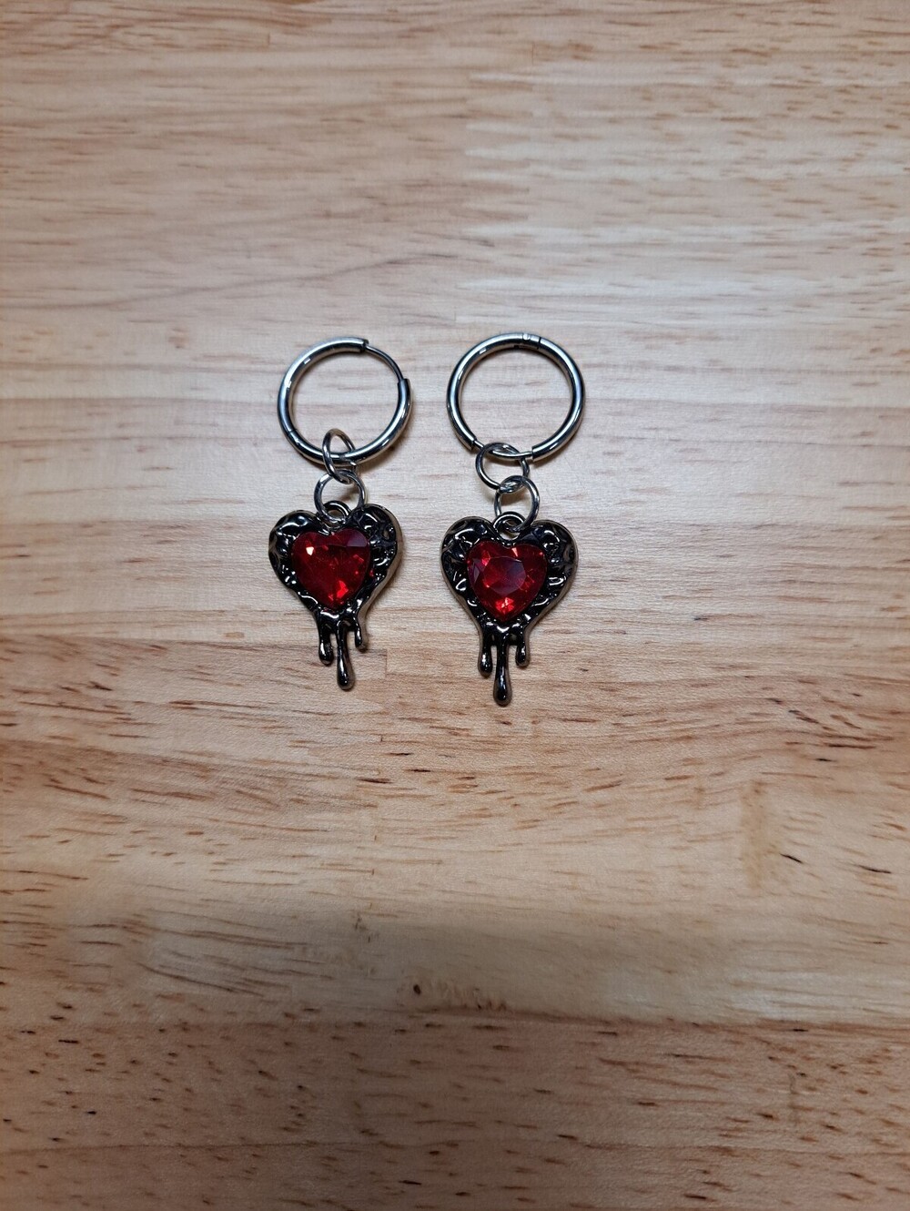 Women's Silver Hoop Earrings with Red Melting Heart Charm